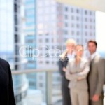 businessman man handsome man African American Man With Colleagues In background The Trent