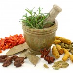 Mortar with fresh rosemary and dried spices