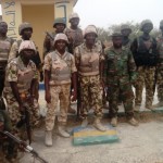 Troops in a group photograph in Police Training College Gwoza after the capture of the town from terrorists