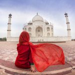 india travelling Woman in red near Taj Mahal