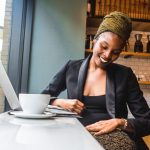 business woman smiling businesswoman professional coffee laptop office pexels-photo-935988