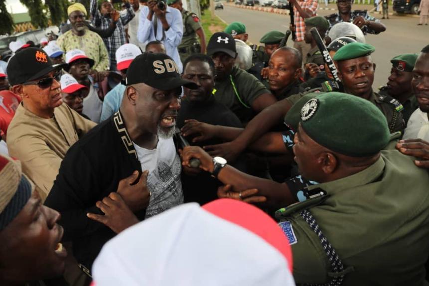 Police teargas PDP leaders, Senate President Bukola Saraki, Senator Ben-Murray Bruce, Senator Dino Melaye, former Jigawa Governor Sule Lamindo, the party chairman, Uche Secondus, Speaker of the House Yakubu Dogara, Governor of Sokoto, Aminu Tambuwal when they staged a protest for a free and fear election at the INEC office in Abuja on October 5, 2018