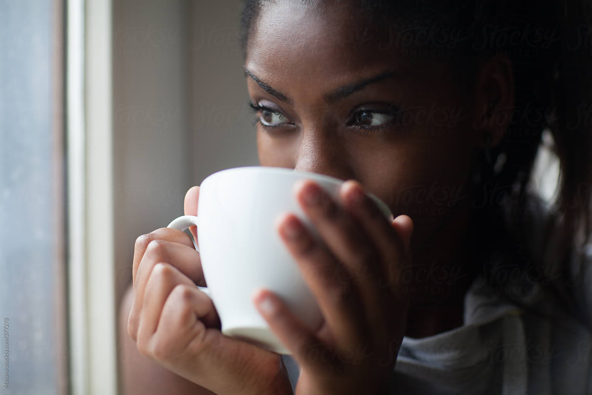 black woman drinking coffee tea, late-night