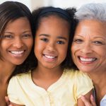 Grandmother with adult daughter and grandchild