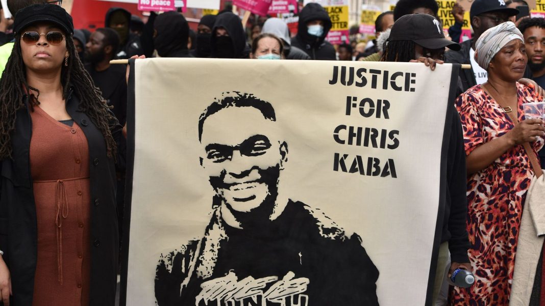 Demonstrators march down Whitehall to Scotland Yard to protest the killing of Chris Kaba.