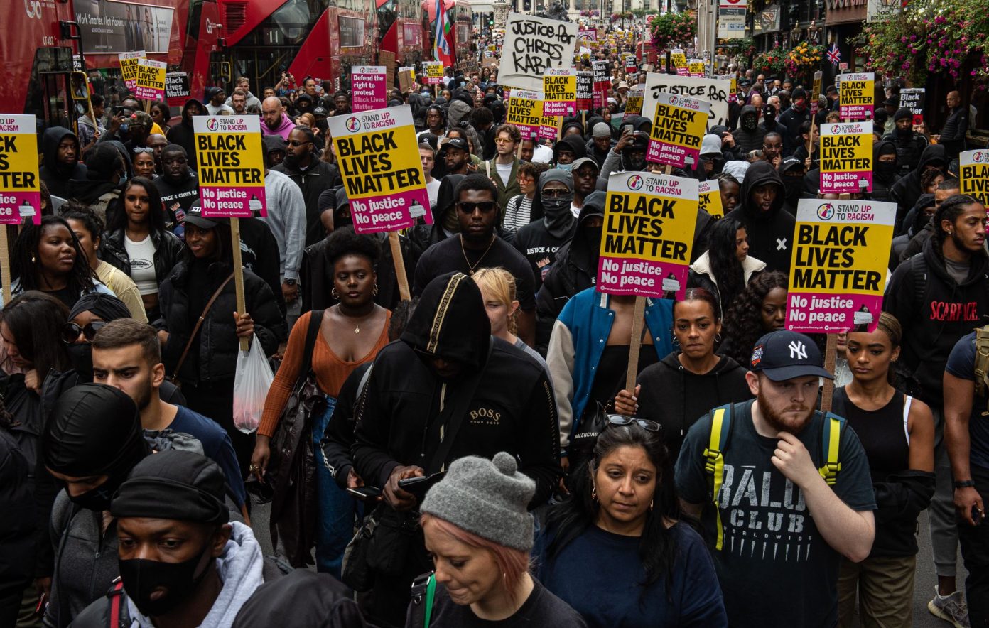 Demonstrators march down Whitehall to Scotland Yard to protest the killing of Chris Kaba. CREDIT: Guy Smallman/Getty Images