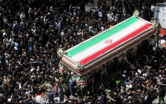 Iran declared five days of mourning and encouraged people to attend the public mourning events. [Majid Asgaripour/WANA via Reuters]