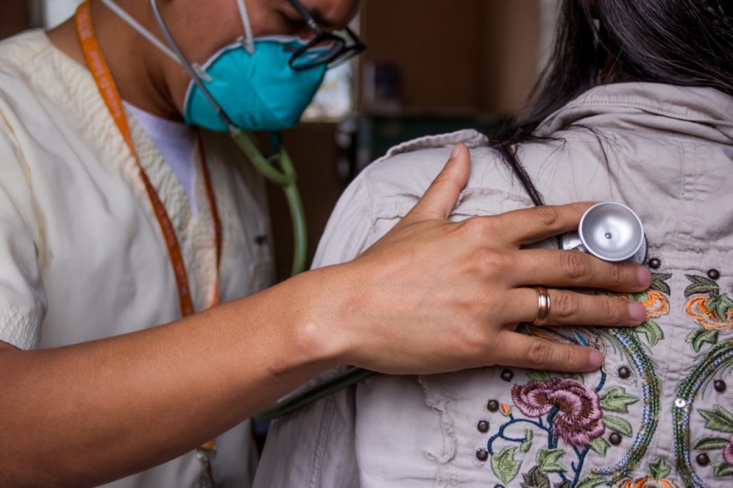 A doctor examines a patient with a severe form of tuberculosis as part of the endTB project at Sergio E. Bernales Hospital in Carabayllo, a northern district of Lima, Peru. Photo by William Castro Rodríguez / Partners In Health