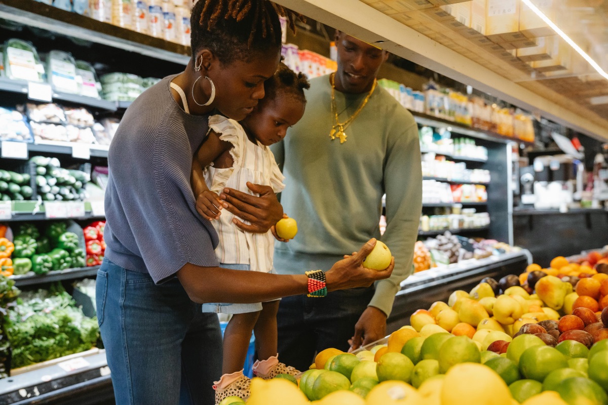 black family shopping for food in supermarket, 