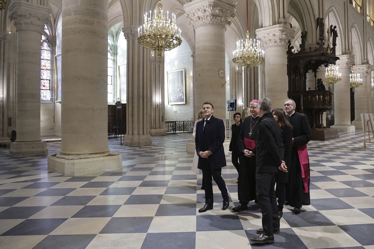 French President Emmanuel Macron visits the restored interiors of Notre Dame cathedral. | Christophe Petit Tesson/AP   