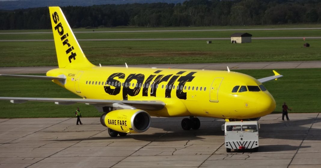 A Spirit Airlines jet seen on a tarmac. | Getty Images