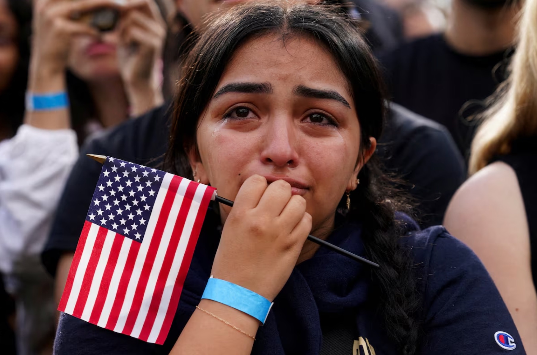 Tears stream down the face of a supporter as Democratic presidential nominee U.S. Vice President Kamala Harris delivers remarks, conceding 2024 U.S. presidential election to President-elect Donald Trump, at Howard University in Washington, U.S., November 6, 2024. | REUTERS/Evelyn Hockstein  