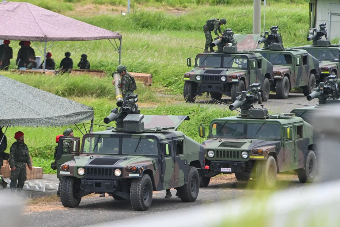 Military vehicles line up to launch U.S.-made TOW A2 missiles during a live-fire exercise in Pingtung County, southern Taiwan, on July 3, 2023. | Sam Yeh/AFP/Getty Images