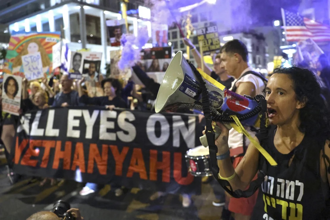 Protesters in Tel Aviv call on Netanyahu to strike a deal to release hostages held in Gaza, in late October. | Jack Gue3z/AFP/Getty Images