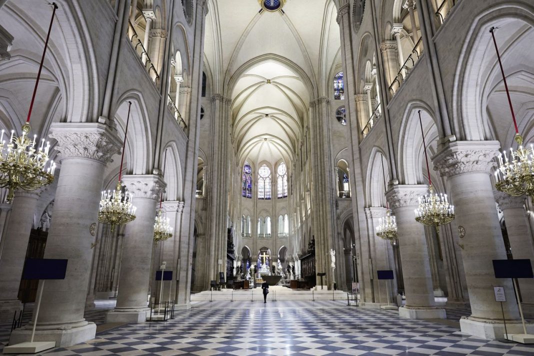 This photograph shows the newly restored nave of Notre Dame cathedral. | Stephane de Sakutin/AFP/Getty Images 