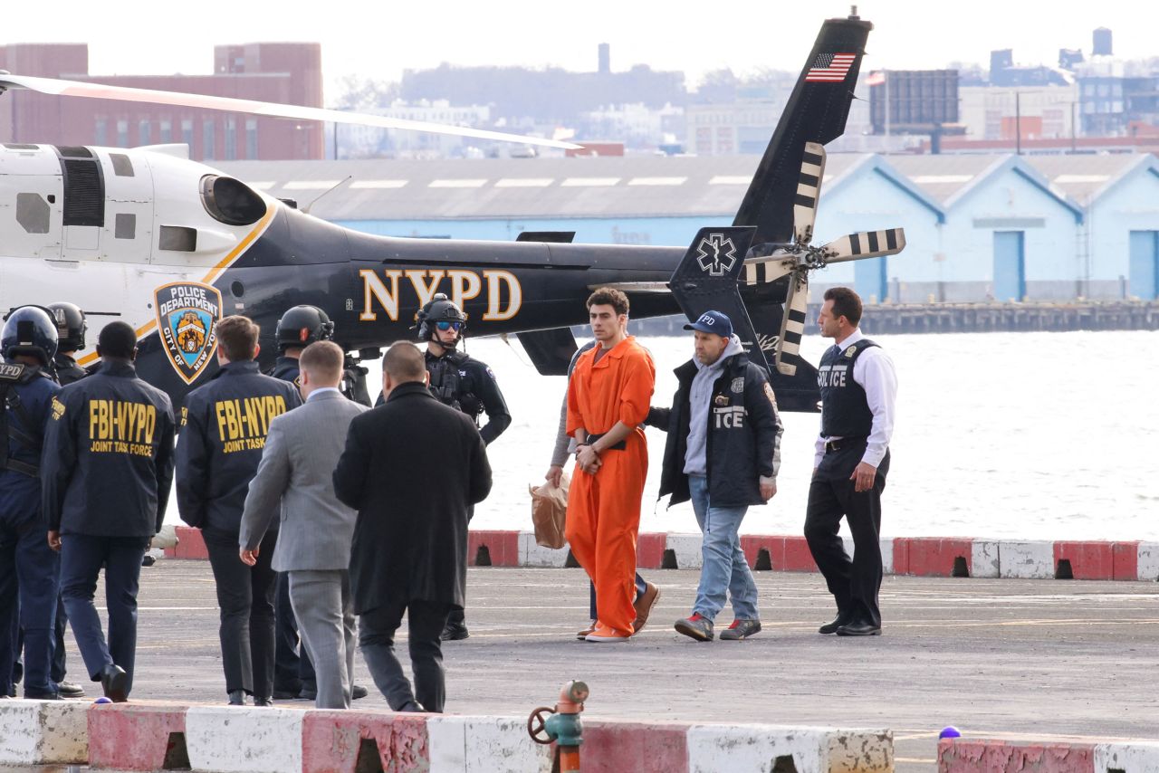 Luigi Mangione is escorted at a helicopter pad in New York on Thursday, December 19, 2024. | Eduardo Munoz/Reuters