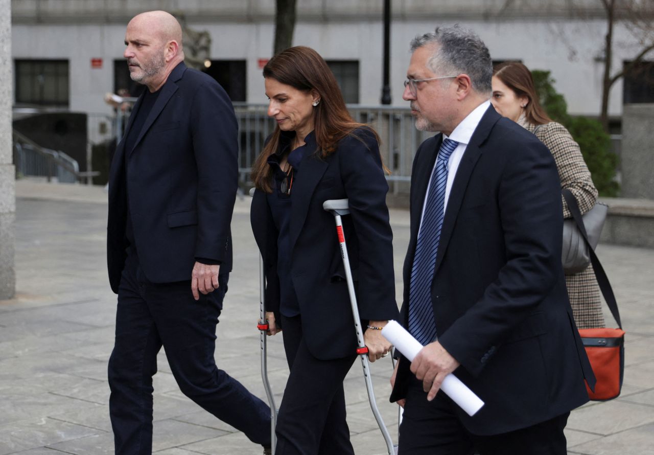 Karen Friedman Agnifilo walks with Marc Agnifilo, right, outside a US district court