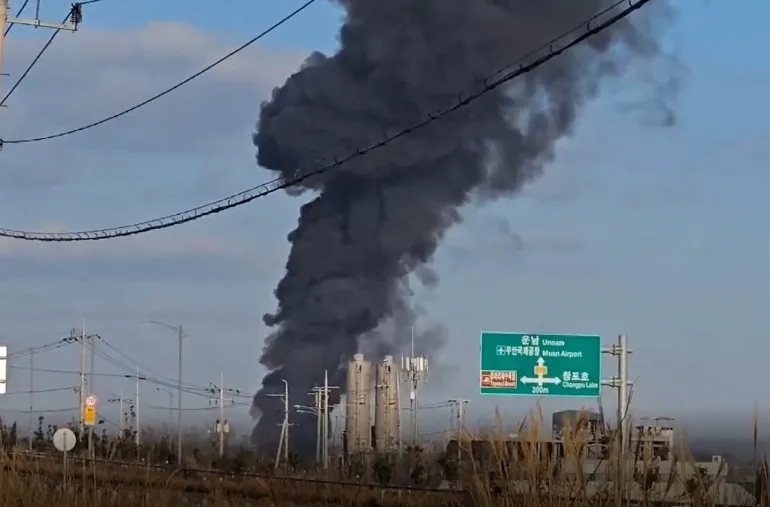   Black smoke billows into the air from the airport in Muan, South Jeolla Province, South Korea, after the plane crash on December 29, 2024. | Yonhap via Reuters  