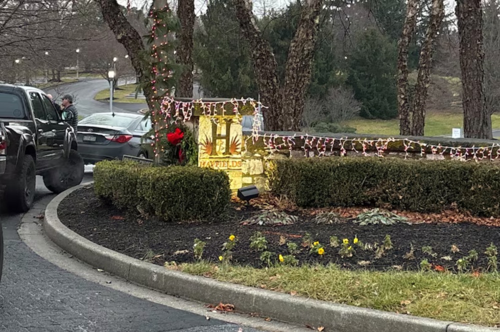  A Baltimore County police vehicle blocks road leading into the Hayfields Country Club, in Cockeysville, Md., owned by the family of Luigi Mangione, a man New York City police described Monday as a "strong person of interest" in the slaying of United Healthcare CEO Brian Thompson. | Wendy Ruderman/The Philadelphia Inquirer