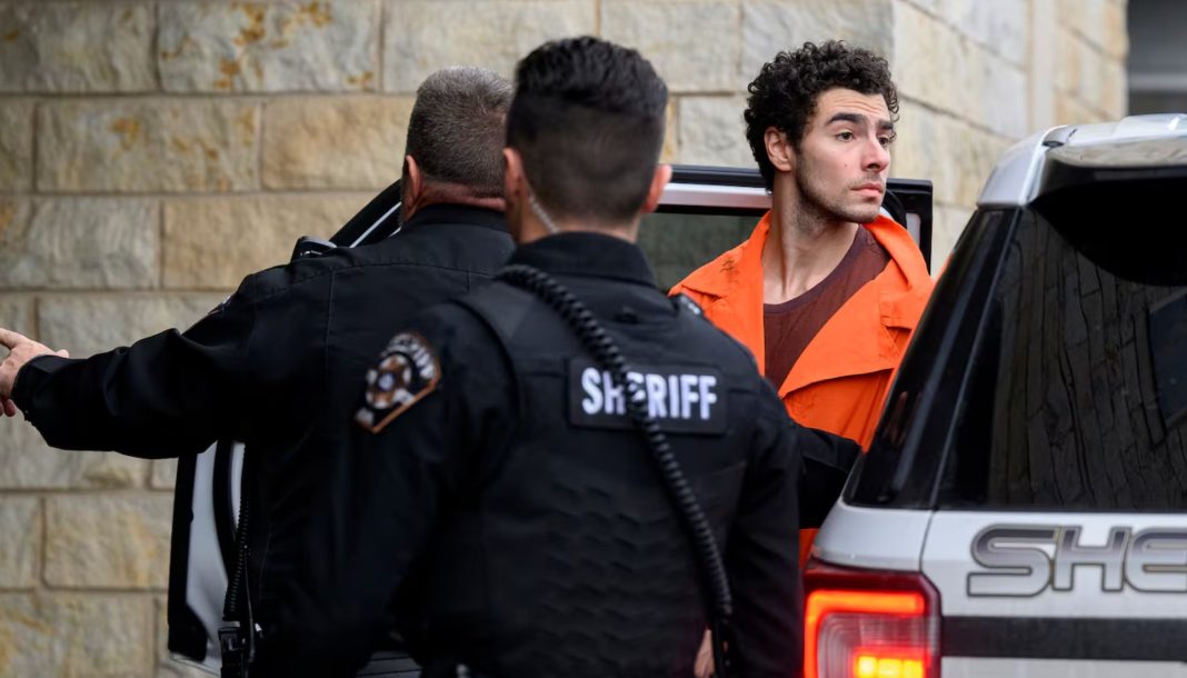  Luigi Mangione is led into the Blair County Courthouse for an extradition hearing Dec. 10, 2024 in Hollidaysburg, Pennsylvania. Mangione has been arraigned on weapons and false identification charges related to the fatal shooting of United Healthcare CEO Brian Thompson in New York City. Mangione is incarcerated in the State Correctional Institution in Huntingdon, Pennsylvania awaiting extradition to New York. | Jeff Swensen/Getty Images