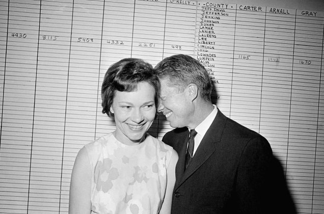 The Carters share a light moment at his campaign headquarters in Atlanta in 1966. Jimmy, a Georgia state senator at the time, ran for governor but lost in the Democratic primary. | Horace Cort/AP