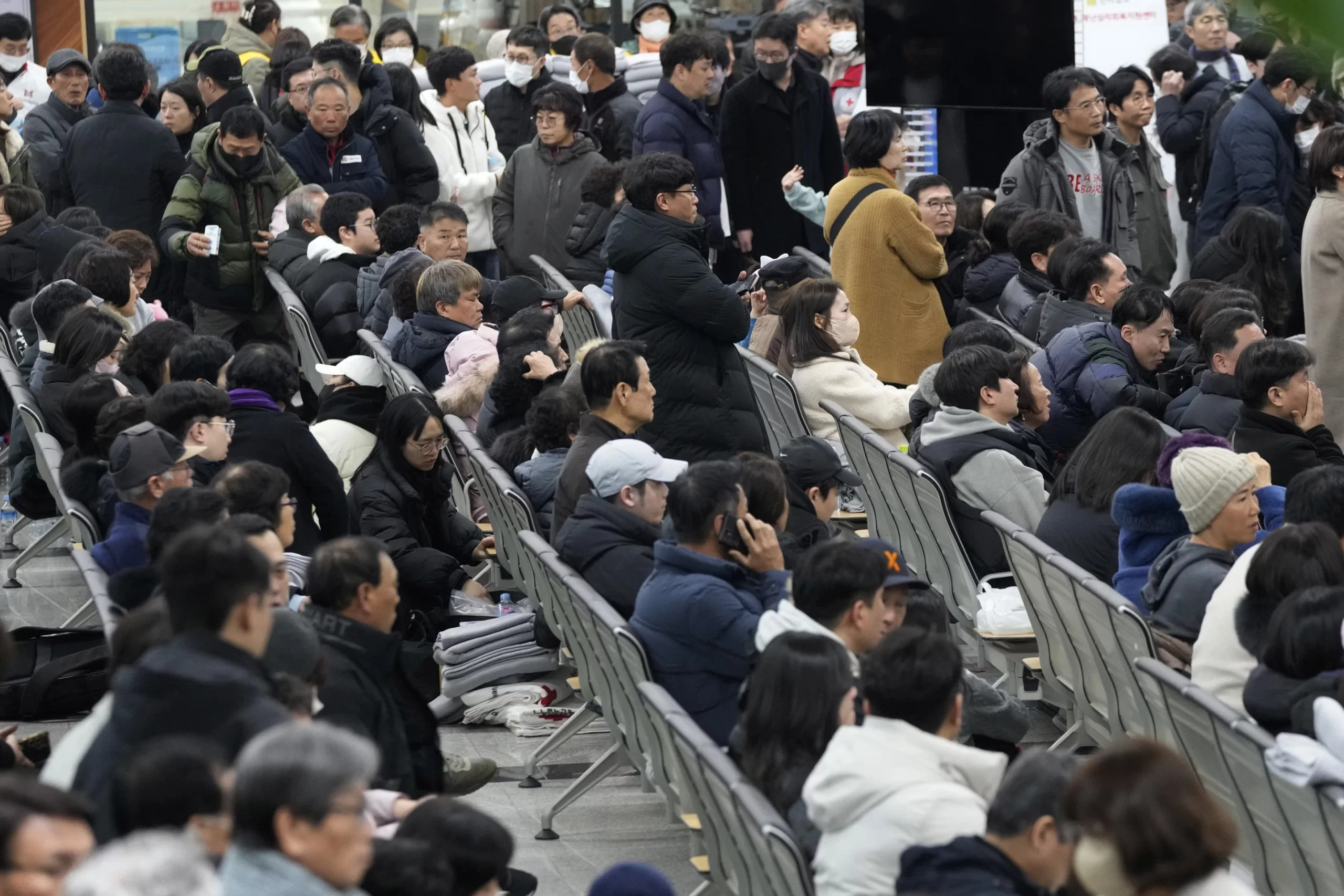 Relatives of passengers gather at Muan International Airport in Muan, South Korea, Sunday, December 29, 2024, after a Jeju Air passenger plane crashed at the airport. | AP Photo/Ahn Young-soon