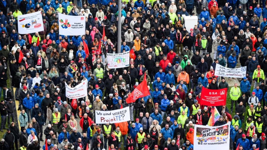 Workers protest outside Volkswagen's headquarters in Wolfsburg, Germany, on December 2, 2024.