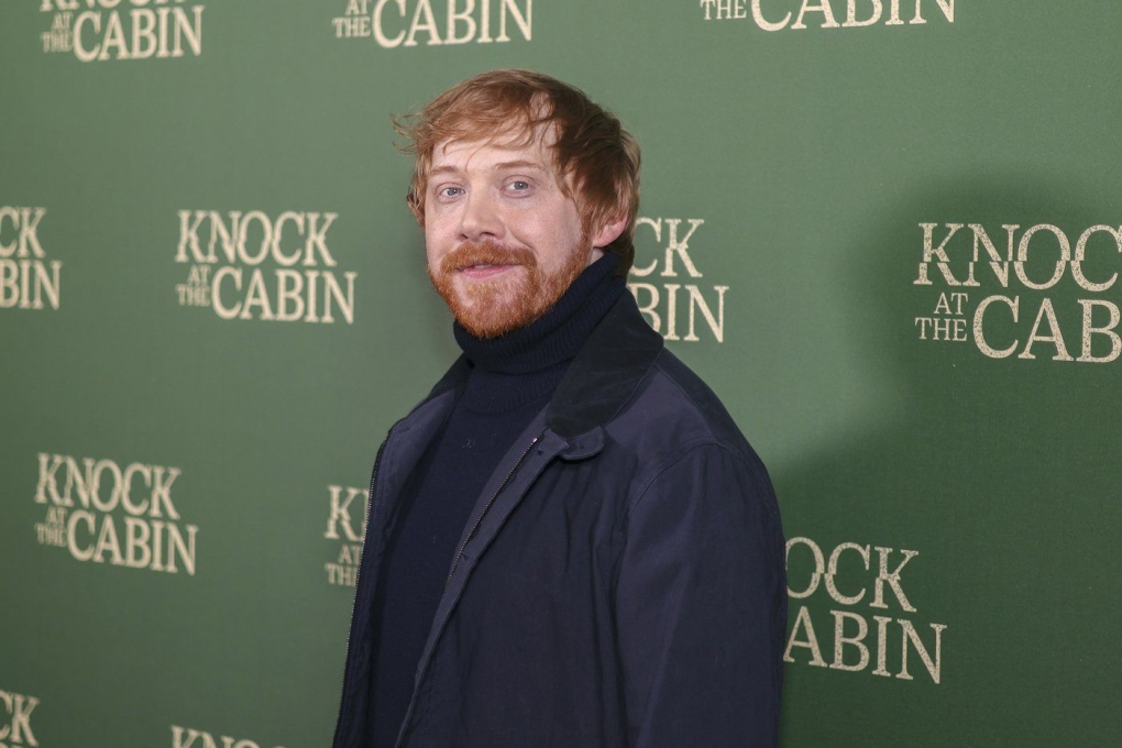 Rupert Grint poses for photographers upon arrival at the special screening of the film 'Knock at the Cabin' in London, Wednesday, Jan. 25, 2023.