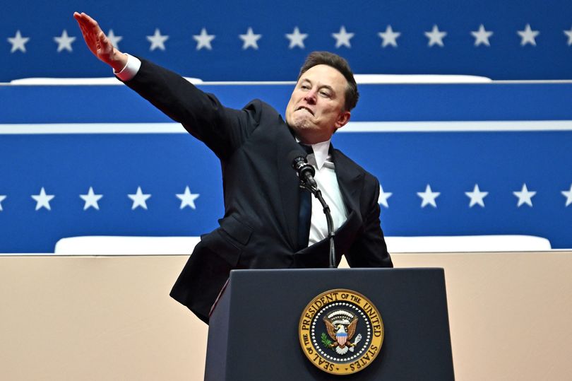 Elon Musk salutes the audience at a Trump inaugural event in Washington, D.C. on January 20, 2025. Controversy trails this moment as pundits declared his gesture a 'nazi salute'. | AFP via Getty Images