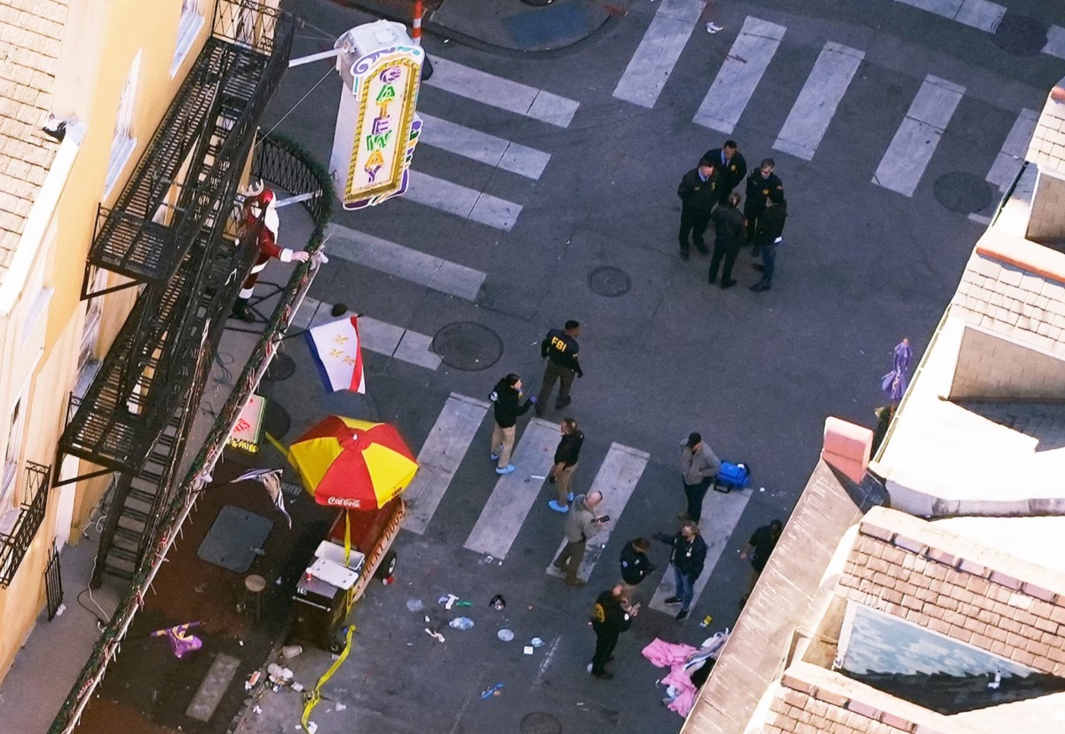 Investigators work the scene after a person drove a vehicle into a crowd killing several, earlier on Canal and Bourbon Street in New Orleans, Jan. 1, 2025.Gerald Herbert/AP