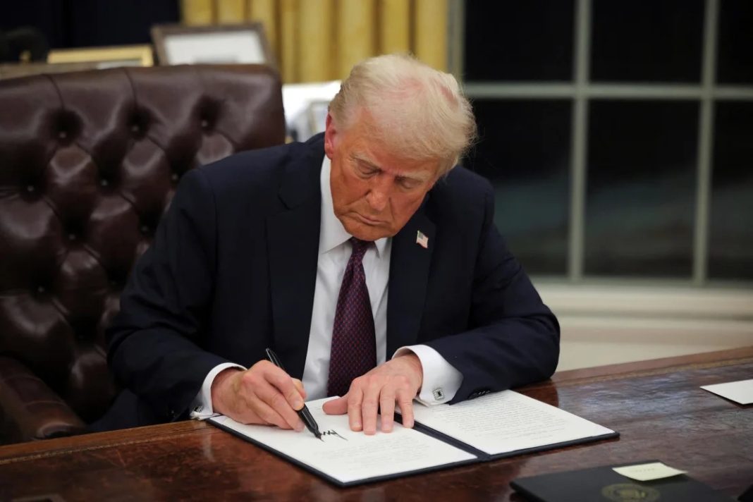 43 countries, Travel Ban, President Donald Trump signs documents as he issues executive orders and pardons for January 6 defendants in the Oval Office at the White House on Inauguration Day in Washington, DC, on January 20. Since then one of the orders he signed rescinded a 1965 order banning employment discrimination by government contractors.