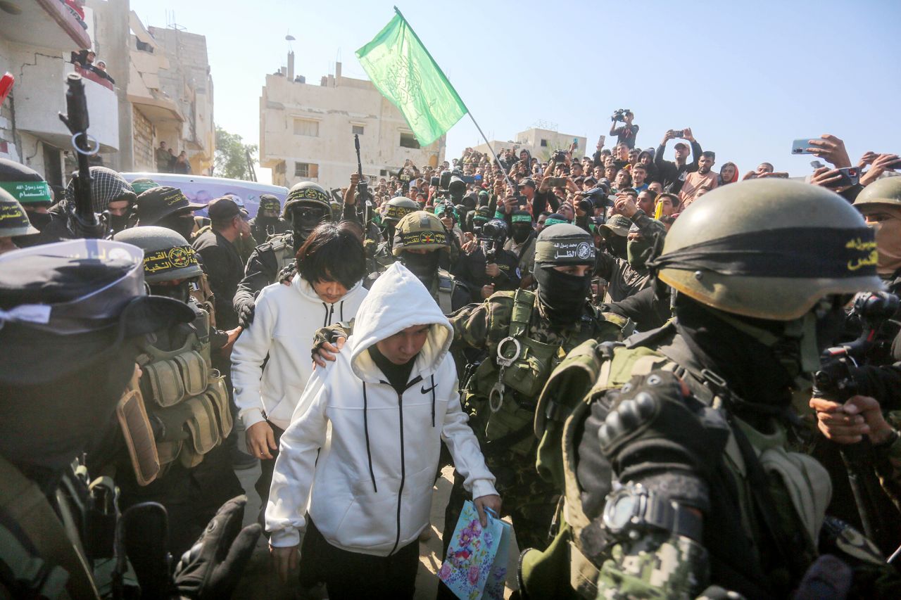 Five Thai hostages are seen arriving ahead of the handover to the members of the International Committee of the Red Cross (ICRC) by Hamas in Khan Younis, Gaza on Thursday, January 30, 2025. | Ashraf Amra/Anadolu/Getty Images 