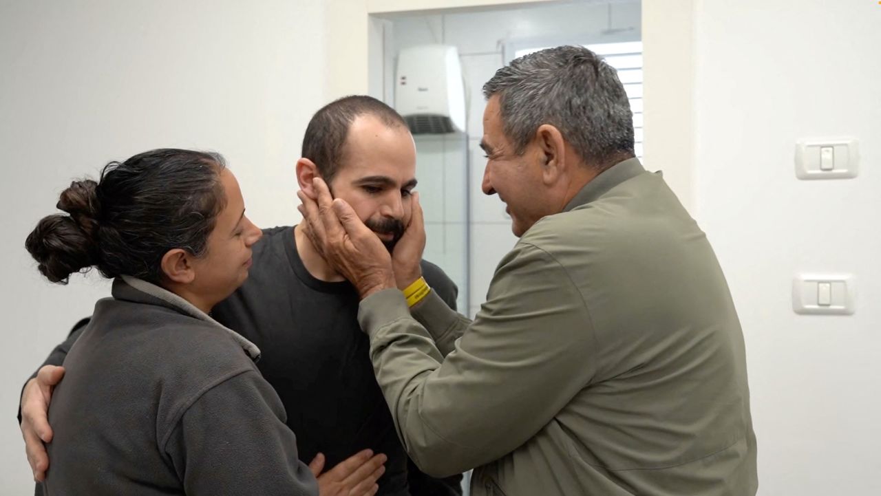 Yarden Bibas embraces his loved ones in an unknown location, in this screengrab from an IDF handout video on Saturday, February 1, 2025. | Israel Defense Forces/Reuters