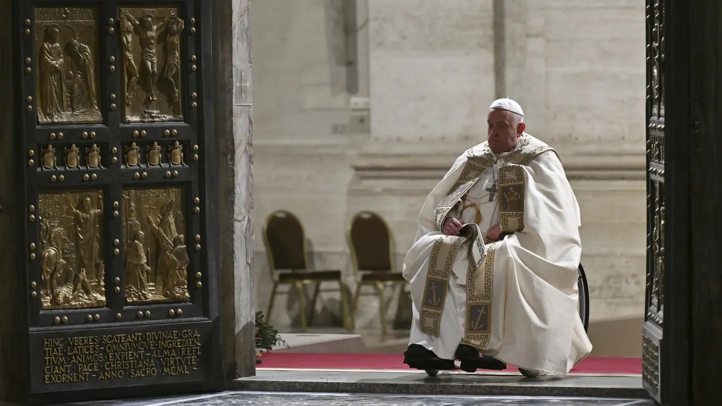 Pope Francis opens the Holy Door of St Peter's Basilica to mark the start of the Catholic Jubilee Year, at the Vatican, Dec. 24, 2024. | Alberto Pizzoli/Pool Photo via AP