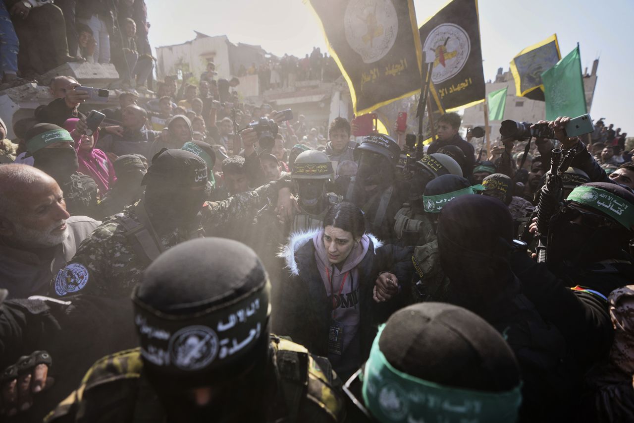 Arbel Yehoud is escorted by Hamas and Islamic Jihad fighters as she is handed over to the Red Cross in Khan Younis on Thursday, January 30, 2025. | Abdel Kareem Hana/AP