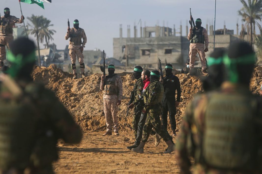 Yarden Bibas is handed over to the Red Cross by Hamas fighters in Khan Younis on Saturday, February 1, 2025. | Jehad Alshrafi/AP