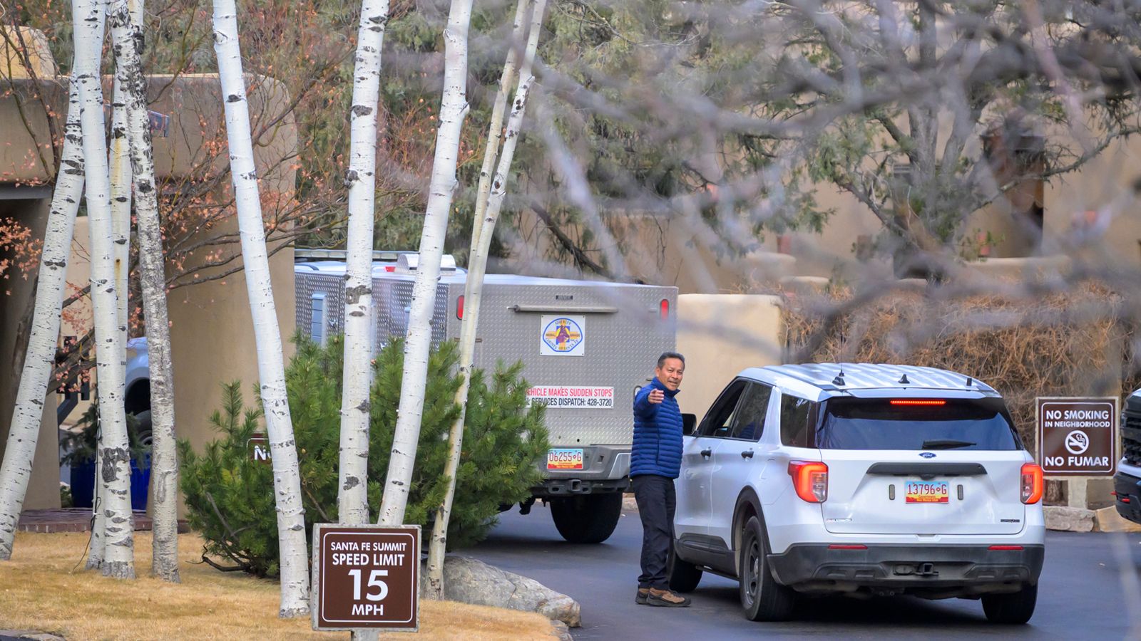 Santa Fe County Sheriff deputies arrive at the Santa Fe Summit gated community where actor Gene Hackman and his wife Betsy Arakawa were found dead on Thursday. Roberto E. Rosales/AP