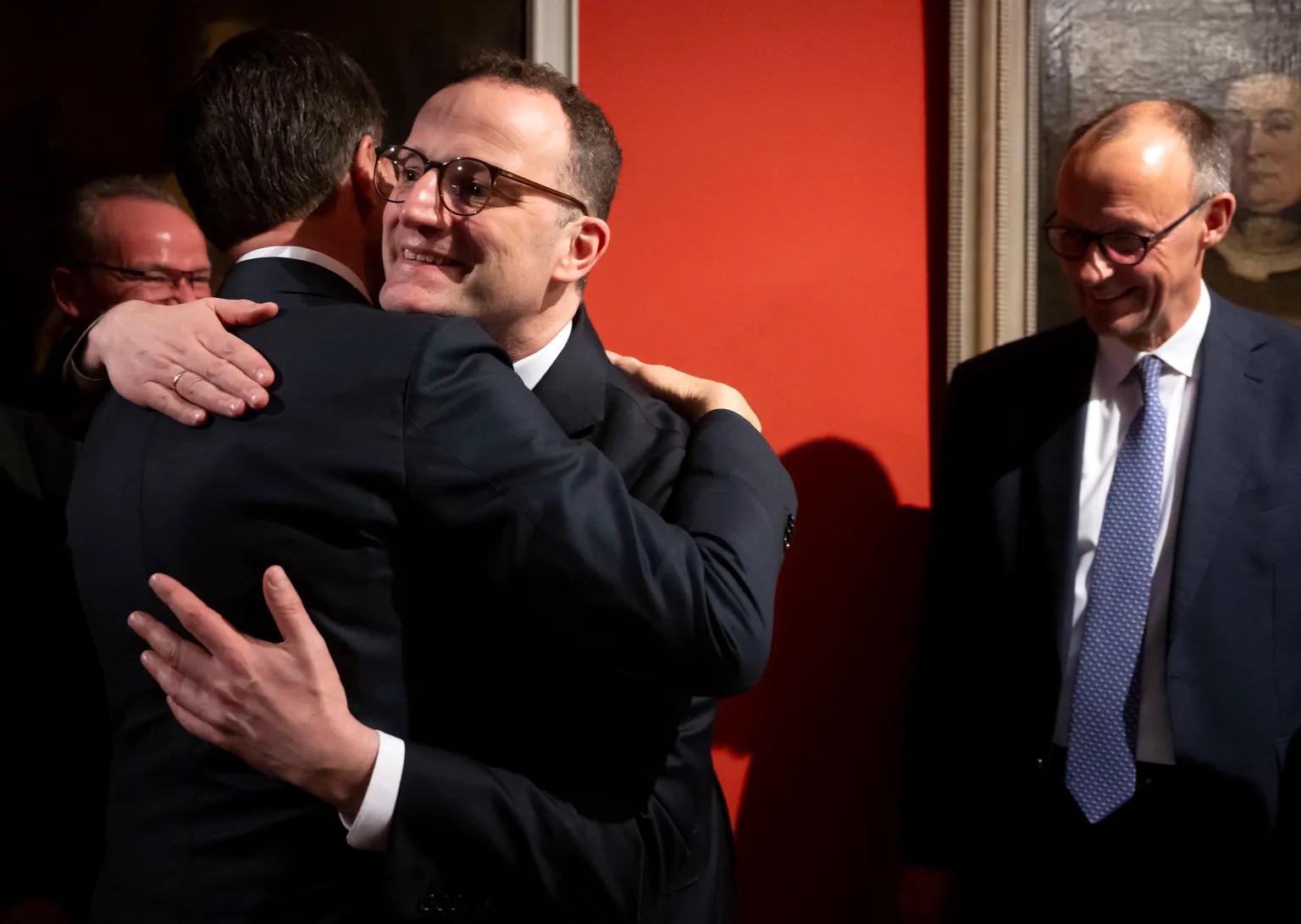  Federal Chairman of the CDU and CDU candidate for Chancellor Merz Friedrich Merz and NATO Secretary General Mark Rutte, back to the camera, hug each other as they meet for talks at the Munich Security Conference, Germany, Friday Feb. 14, 2025. | Sven Hoppe/dpa via AP